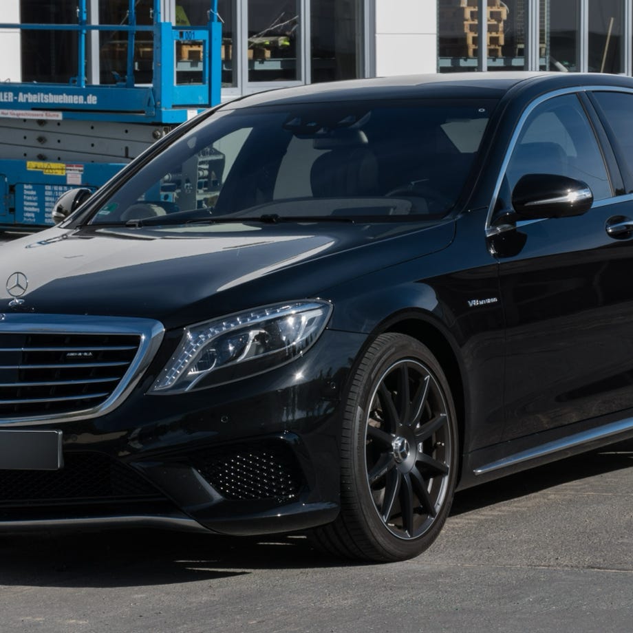 Graduation celebration with board sign saying 'You Did It' on vibrant yellow background.