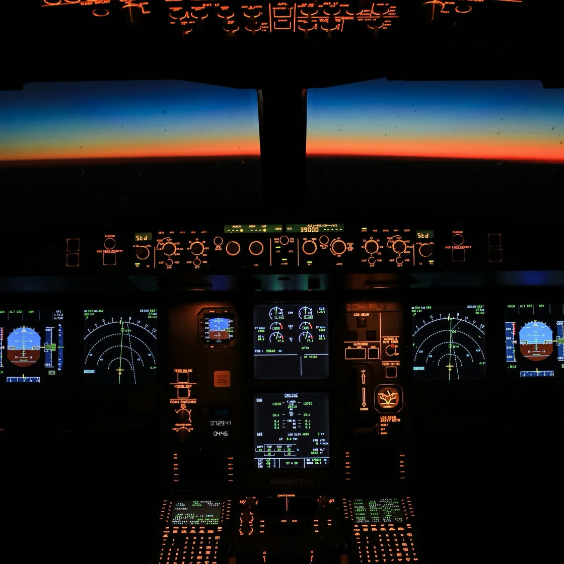 Close-up of a person with blooming sunflowers in a decorative vase outdoors.